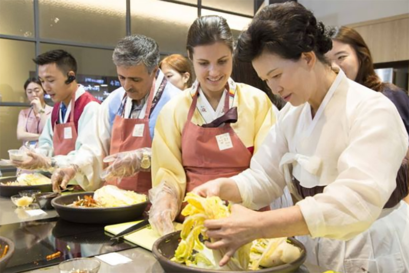 People preparing Korean food together
