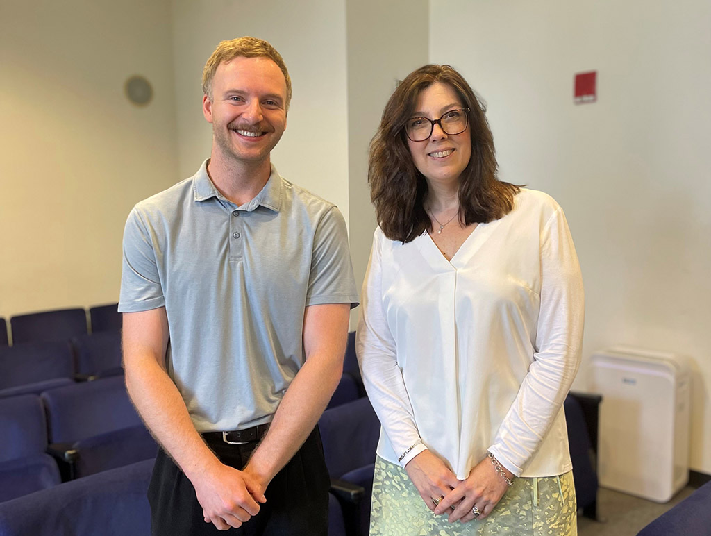 A photo of two smiling people 