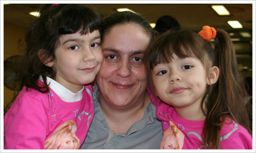Monsegur Family enjoy hugs at Christmas.