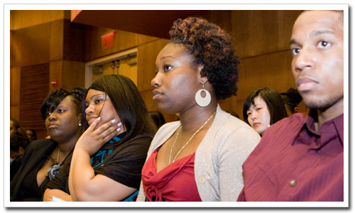 New CPS graduates listen attentively to address by Rev. Alfonso Wyatt.