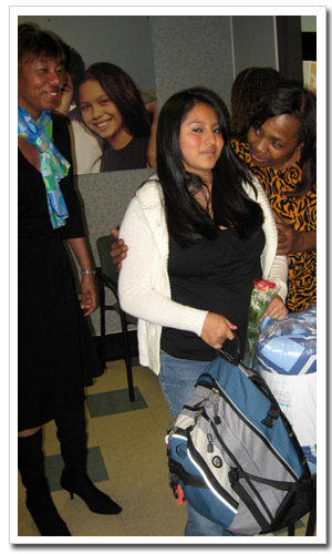 TASA teen mom Sonia Tenecela, a student at Berkley College, receives her Back to School package provided by NYFC, and a word of encouragement from ACS Queens Supervisor Wylanda Forte. Looking on is her case manager, Clover Dewar-March.