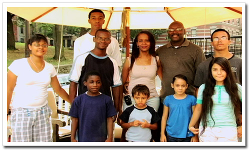 The Fair Family (Lee and Elaine, back row 2nd and 3rd from right) with their children, some of whom were adopted while in foster care.