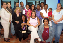 (Left to right) Back row: Dorcas Avitabile, Margarita Marriaga, Deputy Director of Manhattan Field Office, David Nolasco, Sean Urbano, Yeinmy Gomez, Ivelisse Rivera, Sharon Kagawa, Ayanna Ambris, Chastity Daniels, client, her son, Davier Stevens, and Reyna Marte, client. Front row: Mona Yoffie, Renee Hull, Ingrid Dominguez, Field Instructor/Site Director, and Pamela Turner.