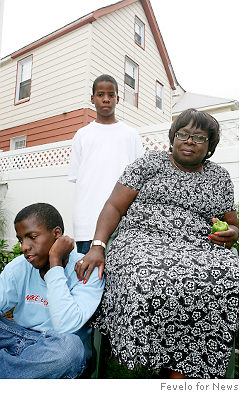 Antoinette Cotman with Nathaniel (l.), 15, and Devin, 12, foster children   whom she eventually adopted.