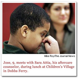 Jose, 9, meets with Sara Attia, his aftercare counselor, during lunch at Children's Village in Dobbs Ferry.