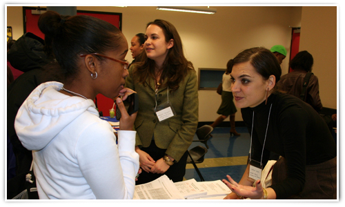 17 year old Nakima listens to Caryne Hayes (right) from C-CAP talk ...