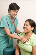 doctor checking patient's heart