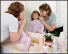 mom teaching child to brush their teeth
