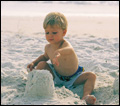 boy playing in sand