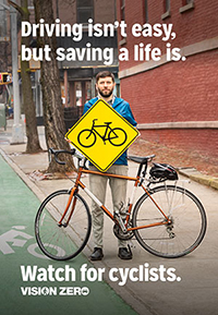 Vision Zero sign. Driving isn't easy, but saving a life is. Watch for Cyclists.