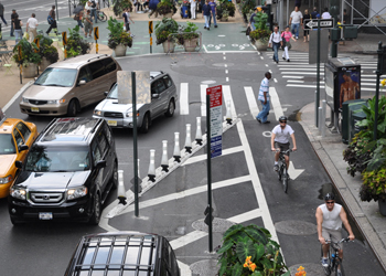 Cyclists riding along new protected paths near Herald Square in Manhattan, created as part of Green Light for Midtown.