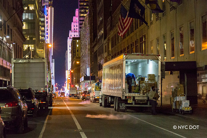 Truck Delivering goods in front of TGIF FRidays Truck Delivering goods in front of TGIF FRidays
