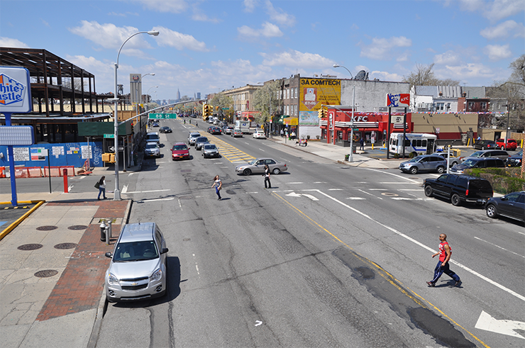 Before conditions: Pedestrians cross Northern Boulevard at 88th Street.