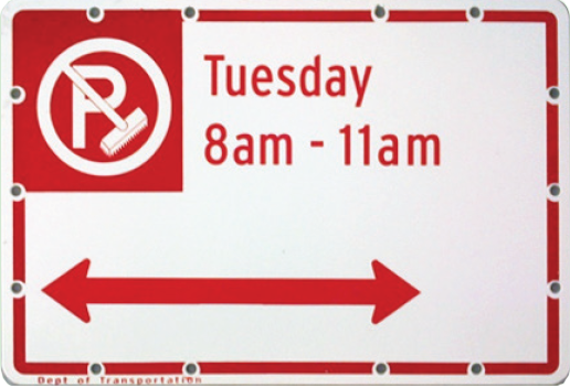 A white street sign with a No Parking due to Street Cleaning symbol. Text reads Tuesday 8am-11am followed by a red arrow pointing in both directions