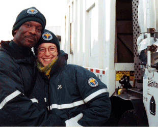 Dr. Robin Nagle and a Sanitation worker in front of a collection truck