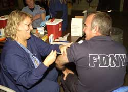 A firefighter receives the flu vaccine as part of the 2005 BIOPOD exercise.