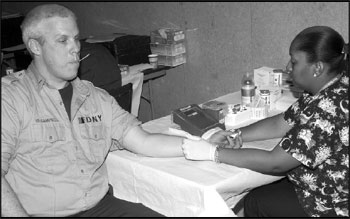 Lt. George Campbell of Engine Company 82 prepares to donate blood on February 2at the blood drive sponsored by the NYBC and FDNY.