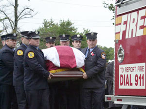 Lieutenant Howard Carpluk is mourned by thousands of family and friends in Islip, Long Island.