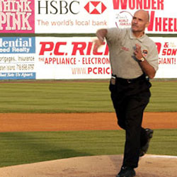Chief of Department Salvatore Cassano throws out the first pitch at a Cyclones game on FDNY Night at Keyspan Park