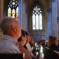 Family members of the 343 Department members who died on 9/11 light their candles as a symbol of hope during a memorial at St. Patrick&rsquo;s Cathedral in Manhattan on September 10.
