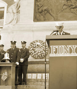 (Right) Lt. Joe Huber, L-38, reads the names of FDNY members lost on 9/11 as (L to R) FF Jerry Heart, E-45; FF Butch Jahoda, L-58; and retired FF Mark Wesseldine, L-58; toll a bell in their memory at the Firefighter's Monument memorial.