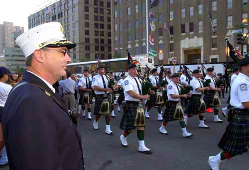 FDNY Chief Cashin stands in review as the Pipes pass by.