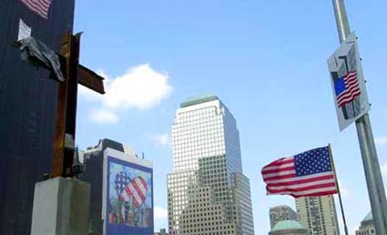 The WTC I-Beam Cross facing Old Glory.