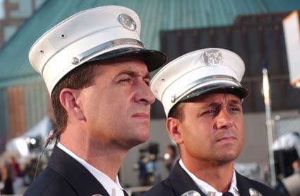 Sons of Chief Raymond Downey honor their father who made the supreme sacrifice on September 11, 2001 looking on at the memorial at Ground Zero.