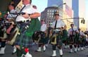 The Pipes march down West Street.