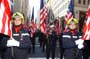 Italian Firefighters marching holding the American Flag