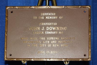 The bronze memorial plaque honoring Firefighter John J. Downing - Ladder Co. 163.