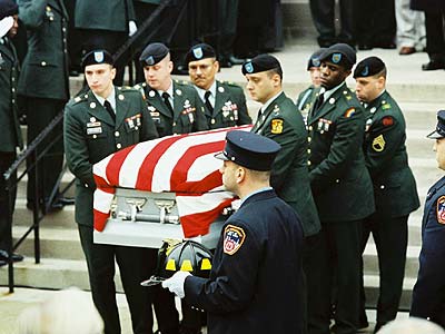 Honor guard and FDNY members assemble as body of Sgt. Christian Engeldrum