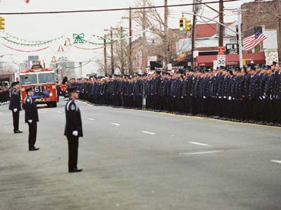 Thousands of police, firefighters and military personnel escorted the casket of New York City firefighter and Army reservist Christian Engeldrum to St. Benedict's church in the Bronx.