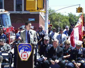 Speaker dedicating street corner in honor of those who have fallen.