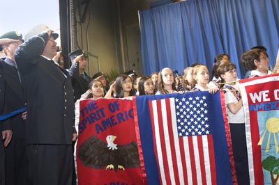 School Children join Firefighters in honoring Firefighters Ford and Fahey.