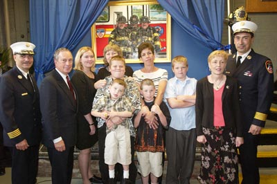 Mayor Bloomberg and FDNY Chiefs Cassano and Nigro join the family at the dedication.