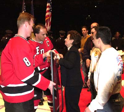 Team members retire Chief Raymond Downey's jersey