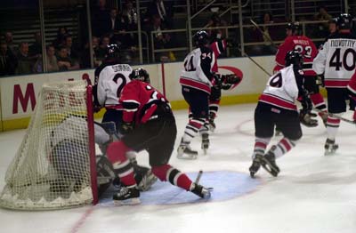 FDNY Joe Florio #21 stuff the puck in against NYPD Goalie Mitchell.