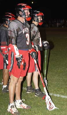 FDNY's Mike Doyle (Ladder 162) keeps his eys on the action from the sidelines along with his fellow teammates.