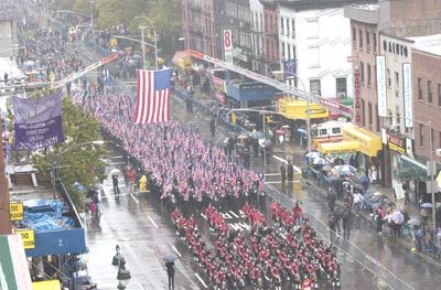 Firefighters from around the world marched from 14th Street to 34th Street in  formation to M