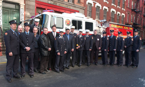 Members of Squad 18 in front of their newly dedicated apparatus. 