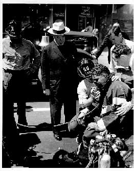 FF receiving oxygen from brother firefighter