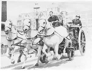 Engine 80 being pulled by team of horses