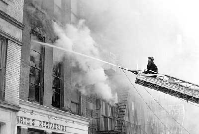 Ladder 15 with aerial raised in action