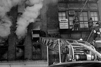 Ladder 15 with aerial raised in action