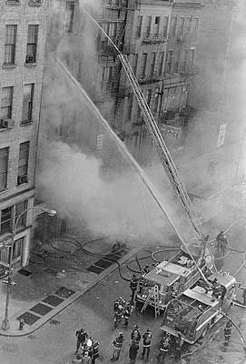 Ladder 15 with aerial raised in action