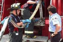 Probys learn to repack the hosebed after the fires are out