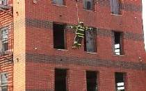 Probys are lowered via a rope down the side of  a building during training