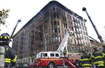 The 6-Alarm fire was brought under control at 8:39 AM, but not before firefighters had to rescue a 104 year old woman from the blaze.