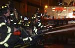 Engine Company hitting fire with hoselines
